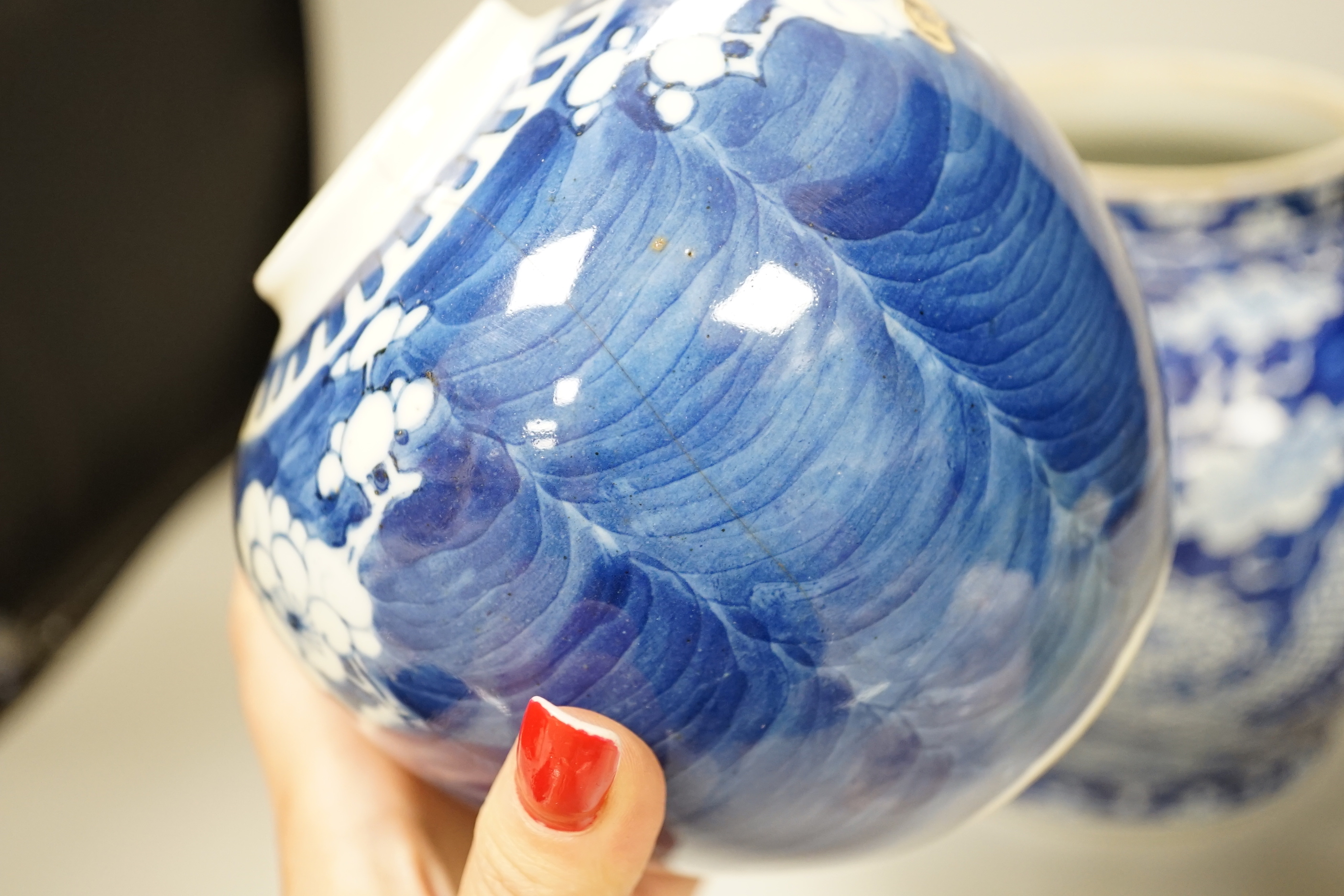 A group of Chinese ceramics including a celadon glazed vase, blue and white jar, white glazed figure and a jardiniere
